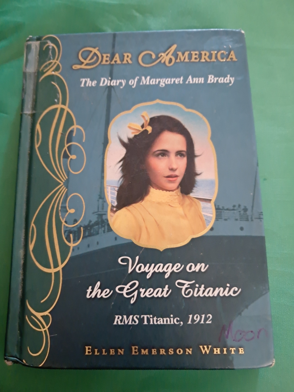 Scholastic Hardcover with Blue Cover and Gold Decorative Accents